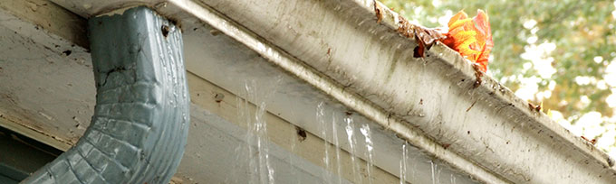 Clogged gutter spilling over